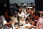 The 1995 Tourists sit down to enjoy their lunch at St. Vaast-la-Hougue on Monday.  (Yes, that's me at the end of the table, about to tuck into some sardines!)