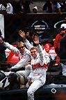 A cheery Tom Kristensen waves to the crowd alongside his teammates Emanuele Pirro and Frank Biela.