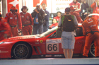 A shot from the tribunes as the #66 Ferrari of Enge, Menu and Kox makes a pitstop.  